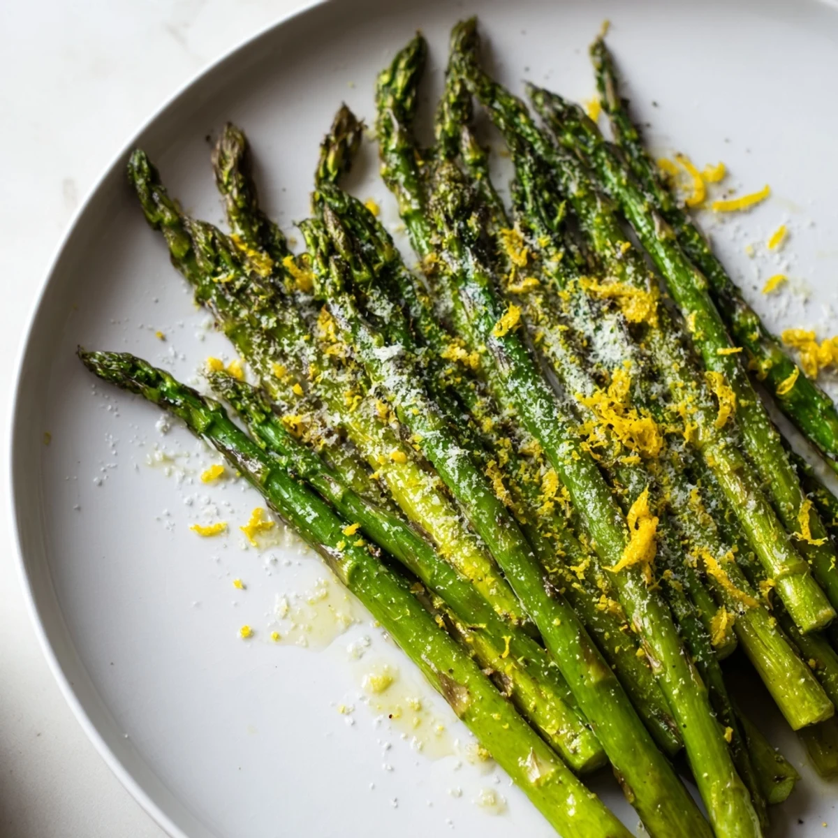 Freshly roasted asparagus glistening with olive oil and topped with Parmesan and lemon zest.