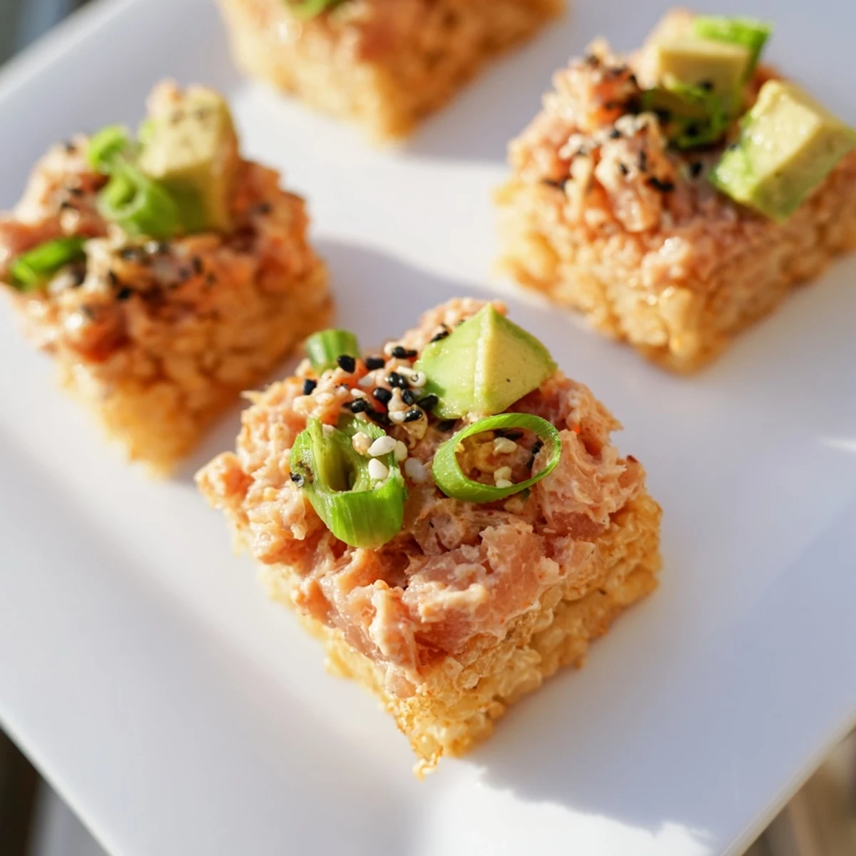 A close-up shot of Spicy Tuna Crispy Rice: beautifully arranged and ready to be enjoyed as a snack.