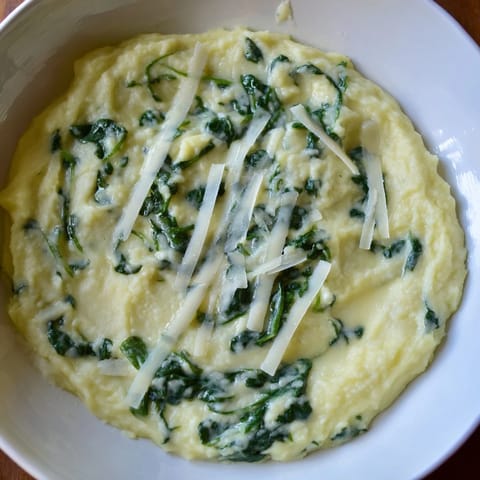 Enjoy homemade Creamy Spinach and Parmesan Mashed Potatoes, a rich, savory, and perfectly textured culinary delight.