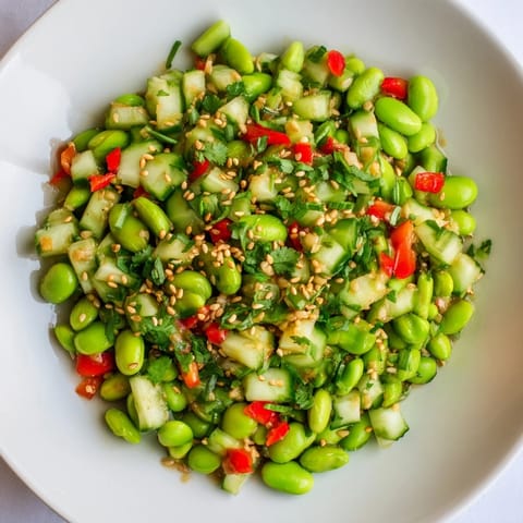 Fresh Edamame Salad, featuring colorful vegetables and sesame seeds; a light, flavorful Asian-inspired side.