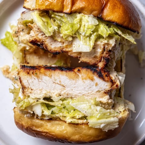 Freshly grated Parmesan melts over tender chicken in this hearty Caesar Chicken Sandwich.