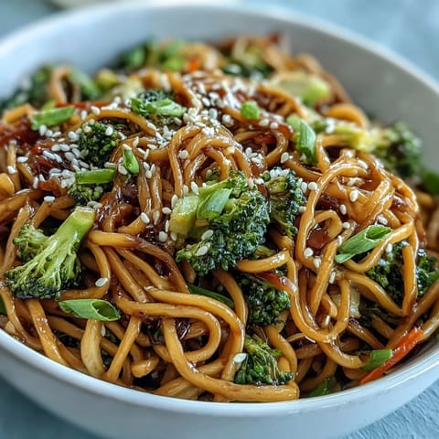 Savory Asian Teriyaki Noodle Bowl with crisp broccoli, carrots, and toasted sesame seeds, ideal for a quick weeknight meal.