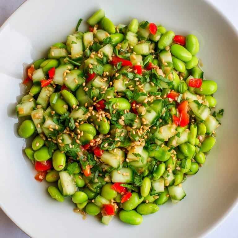 Fresh Edamame Salad, featuring colorful vegetables and sesame seeds; a light, flavorful Asian-inspired side.