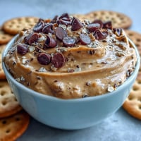 Creamy Fiber-Packed Chickpea Cookie Dough Dip with chocolate chips, ready for dipping.